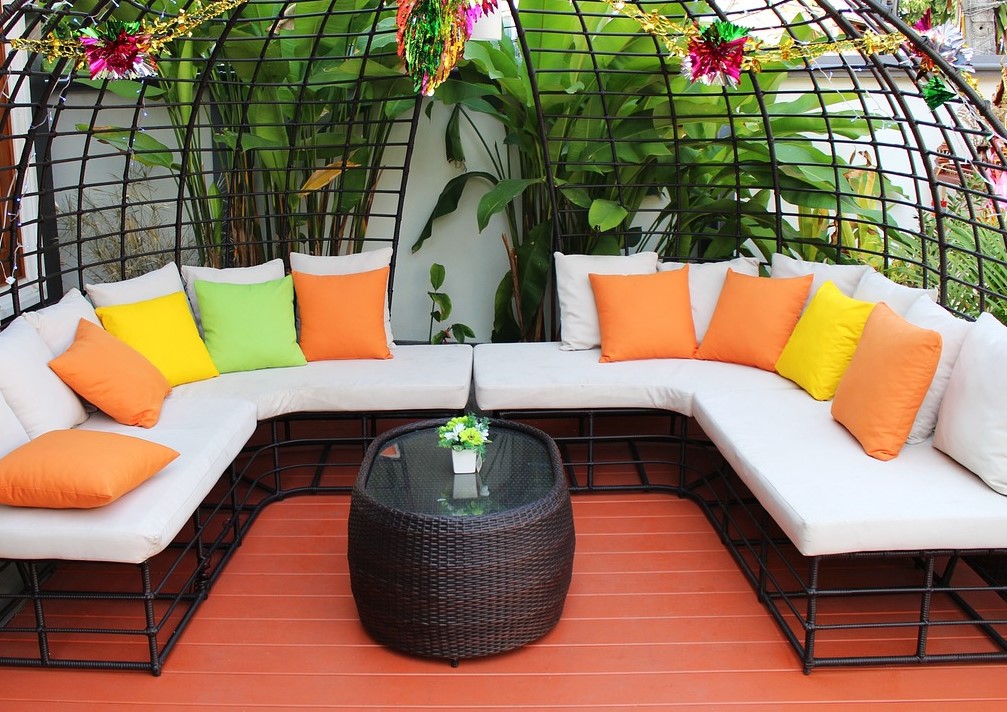 relaxing colors of orange yellow and green on an outdoor sofa and table