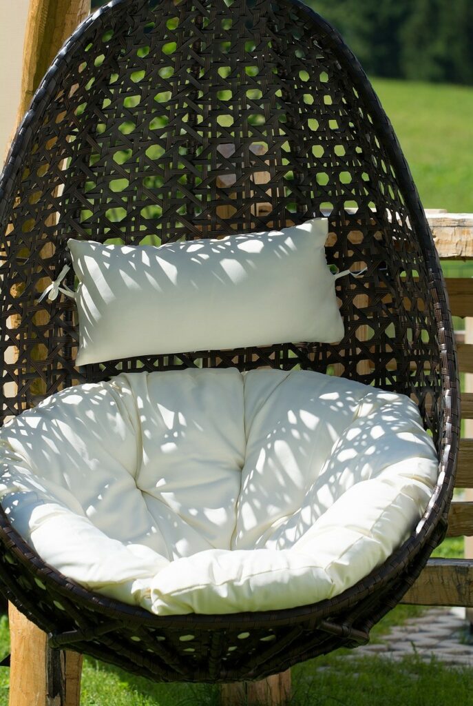Egg chair with cushion hanging outside